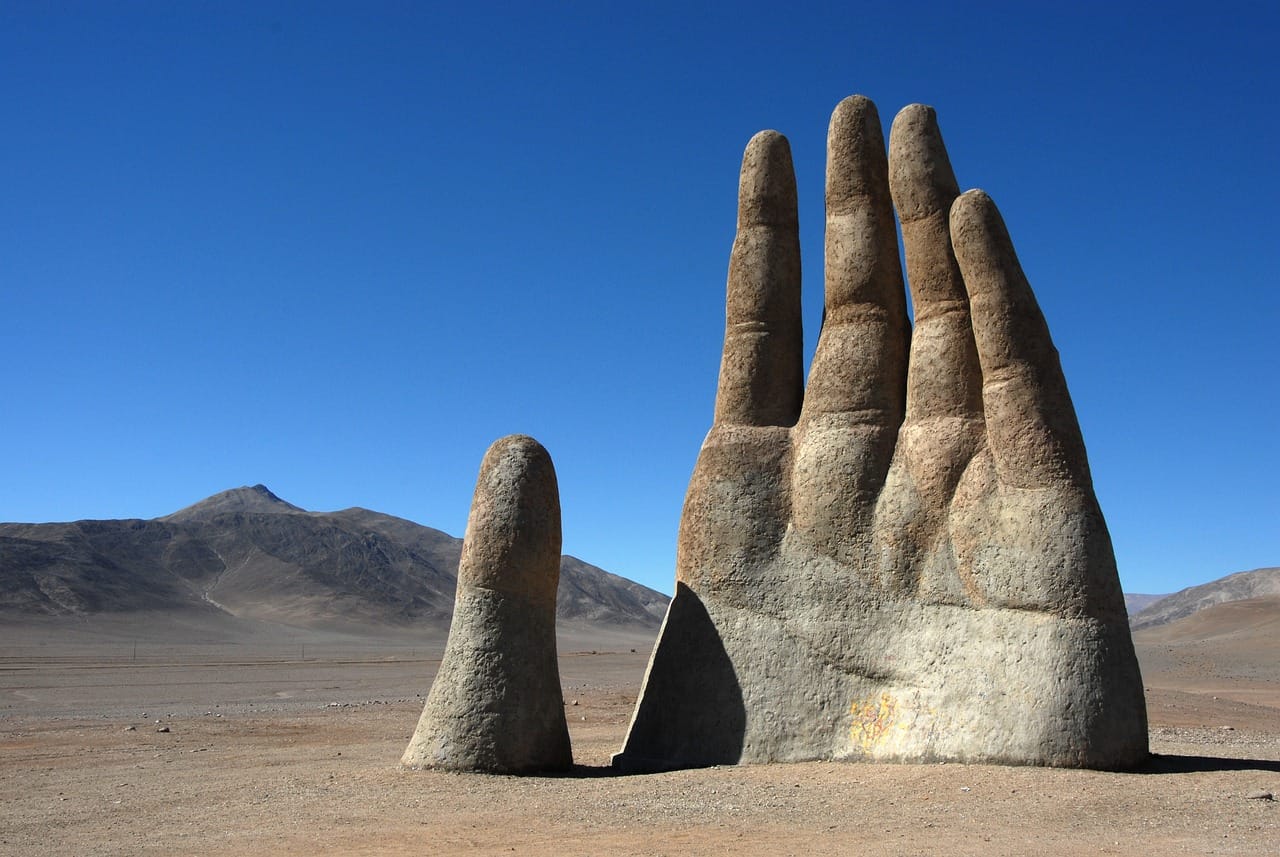 The Hand of the Desert is just one of the many unforgettable attractions in Chile. (Image by Herbert Bieser from Pixabay)
